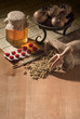 still life with natural medicines and thermometer