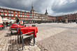 Cafe tables with red tableclothes in Plaza Mayor. Madrid.