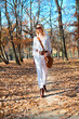 Beautiful  woman walking in the autumn colored park