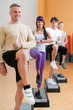 Healthy people doing exercises at gym Healthy people doing exercises at gym