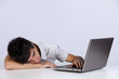 Exhausted man sleeping at his office