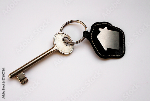 Photo: Isolated key with house icon Isolated key with house icon