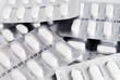 pack of white medicine pills background