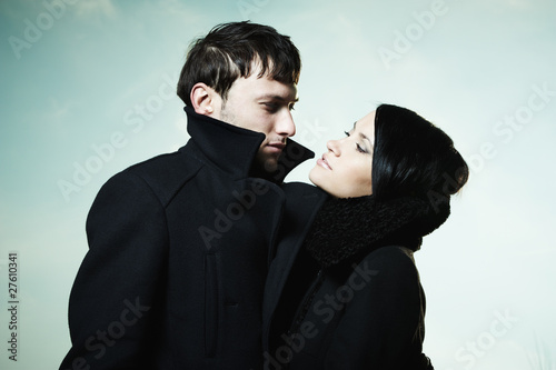 Photo: Portrait of a beautiful young couple outdoors Portrait of a beautiful young couple outdoors