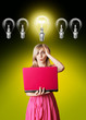 blonde in pink dress with laptop and bulb