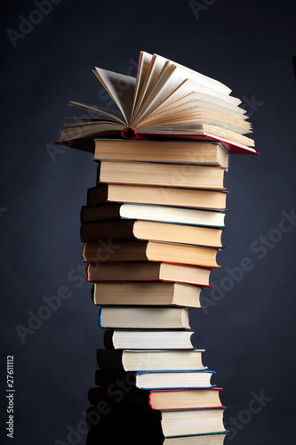 Photo: Pile of books on a black background Pile of books on a black background