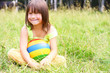 Photo: The child sit on a grass The child sit on a grass