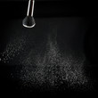 detail of a powder brush with white loose powder