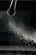 detail of a powder brush with white loose powder