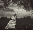 Young beauty woman over nature background in black and white