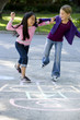 Photo: Girls playing hopscotch Girls playing hopscotch