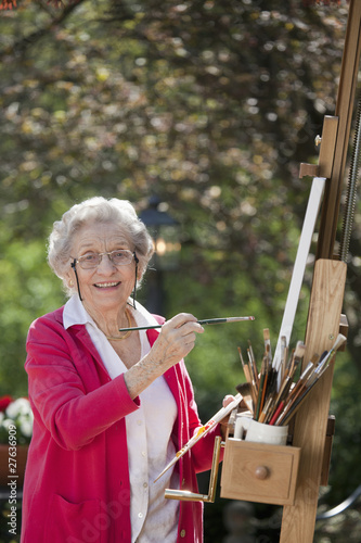 Photo: Smiling Senior Woman Painting Smiling Senior Woman Painting