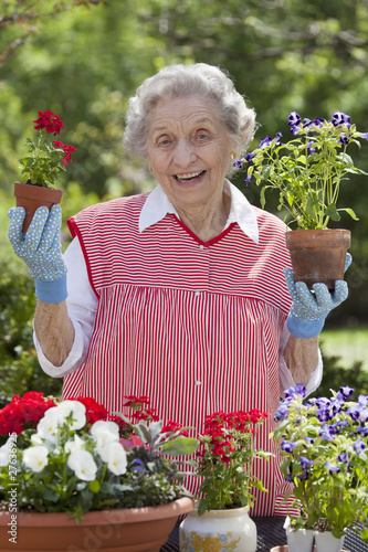 Photo: Smiling Senior Woman Holding Flowers Smiling Senior Woman Holding Flowers