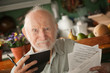 Senior man with many bills