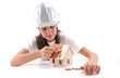 Cool girl building house isolated on white.