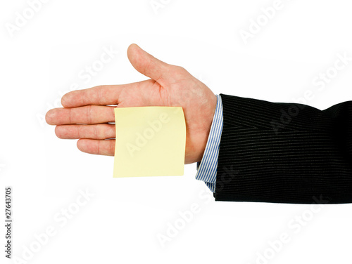 Photo: yellow post it note on hand yellow post it note on hand