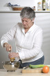 Women is a pepper mill in the kitchen