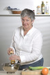 Women is a pepper mill in the kitchen