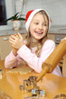 Cutesy Girl Smiling While Christmas Backing