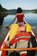 Canoeing girl on a lake
