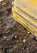 stacked yellow buckets for making cement on construction site
