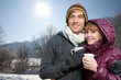 couple drinking tea in the snow