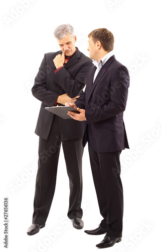 Photo: Two businessmen discussing - Isolated studio picture Two businessmen discussing - Isolated studio picture