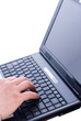 Photo: Male hand typing on a laptop Male hand typing on a laptop