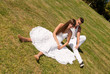 young couple happy sit on grass white clothes, love relationship