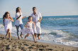 happy young  family have fun on beach