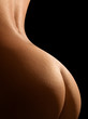 Female bottom isolated on black background.