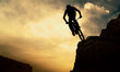 Silhouette of a man on muontain-bike, sunset Silhouette of a man on muontain-bike, sunset