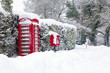 Red telephone and post box in the snow