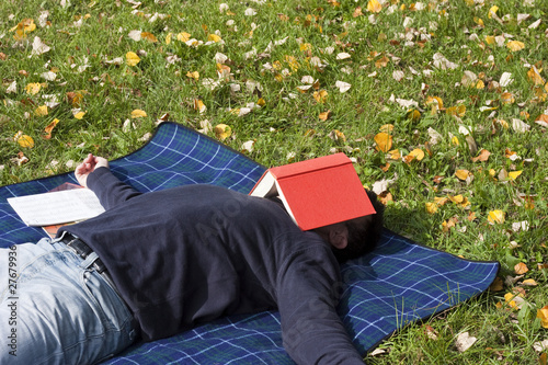 Photo: Young Adult Relaxing in the Park Young Adult Relaxing in the Park