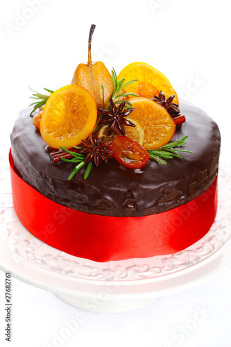 Photo: beautiful chocolate cake with glazed fruit isolated on white bac beautiful chocolate cake with glazed fruit isolated on white bac