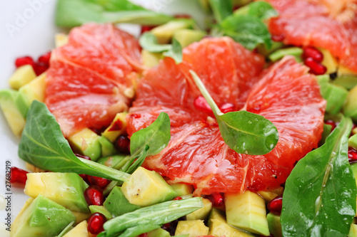 Photo: Fresh salad with grapefruit, avocado and pomegranate seeds Fresh salad with grapefruit, avocado and pomegranate seeds