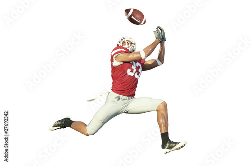 Foto: football player catches ball in midair football player catches ball in midair