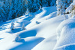 Snowdrifts on winter snow covered mountainside