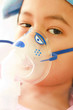 Young boy and hospital instrument on his face