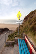 bench and beach landslide caution sign
