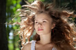Pretty woman posing in forest
