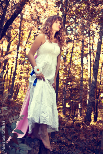 Photo: Pretty woman posing in forest Pretty woman posing in forest