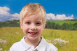 Cute blond smiling boy