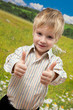Funny little boy showing OK
