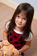 Cute girl holding soft toy