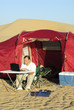 Man with laptop and portable solar charger