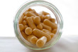 Pills in a glass bottle - front