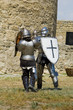 Photo: Medieval european knight near citadel wall Medieval european knight near citadel wall