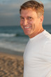 Good looking man in tshirt on the beach