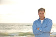 Photo: handsome business man on the beach casual attire handsome business man on the beach casual attire